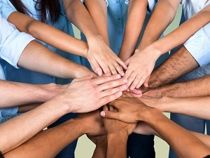 people stacking hands